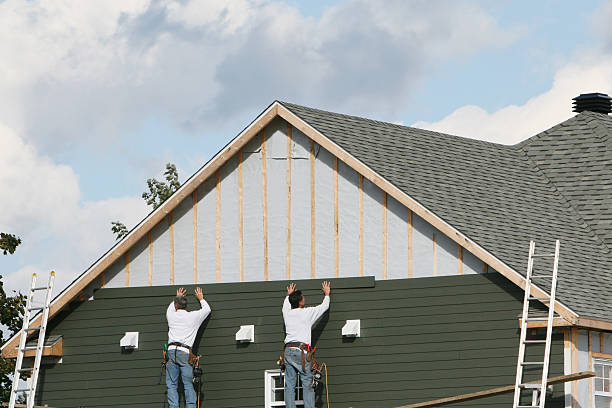 Professional Siding Installation technician working in Parker, FL